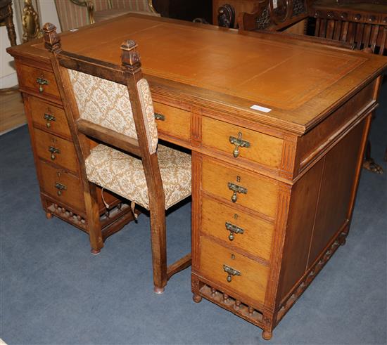 A Victorian golden oak aesthetic influence pedestal desk and chair W.122cm